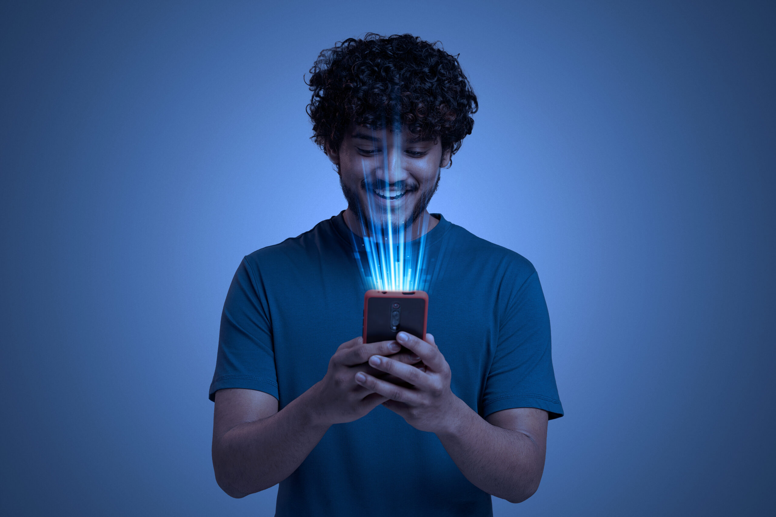A Boy holding a mobile in hand and wondering Can Instagram Posts Show Up in google Search